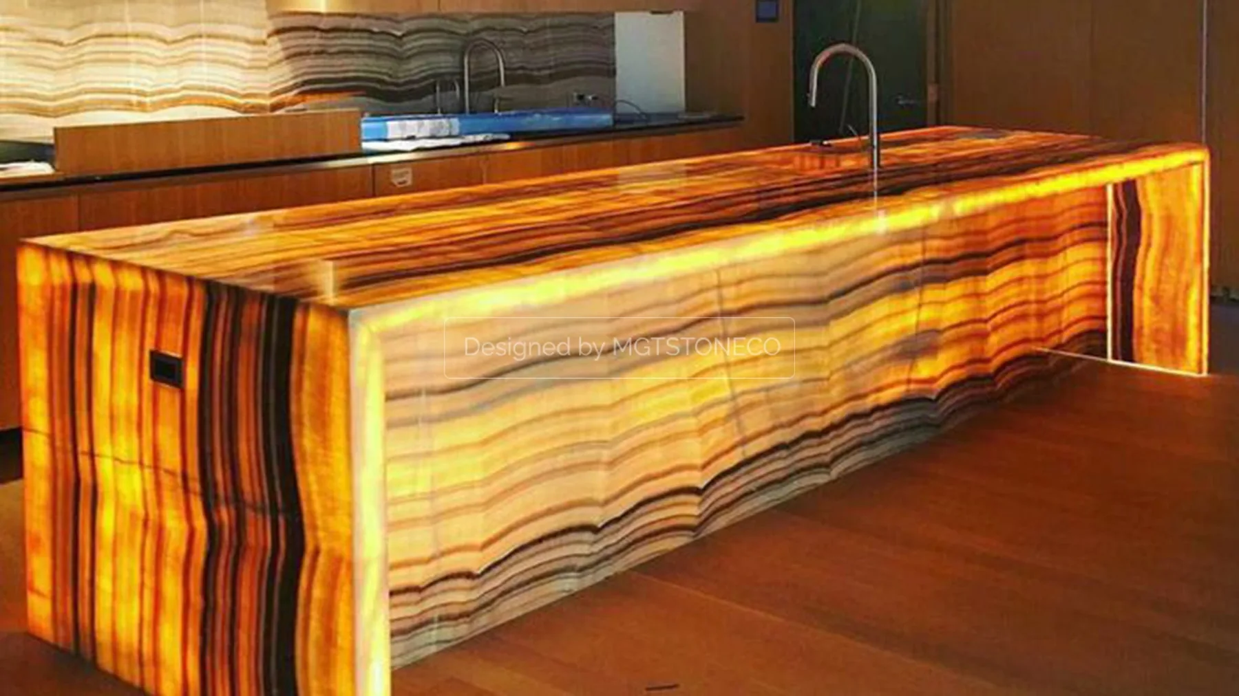 Backlit onyx stone kitchen countertop and waterfall island