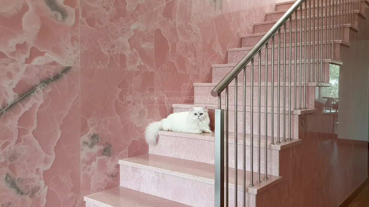 Pink onyx staircase and matching wall cladding