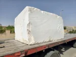 Bianco Limestone quarry block loaded on a flatbed truck