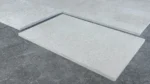 Honed Marva Limestone tiles laid out showing the pale grey-cream surface