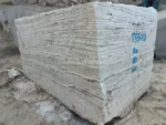 Marjan Silver Travertine quarry block showing layered gray veins, natural pores and blue markings.